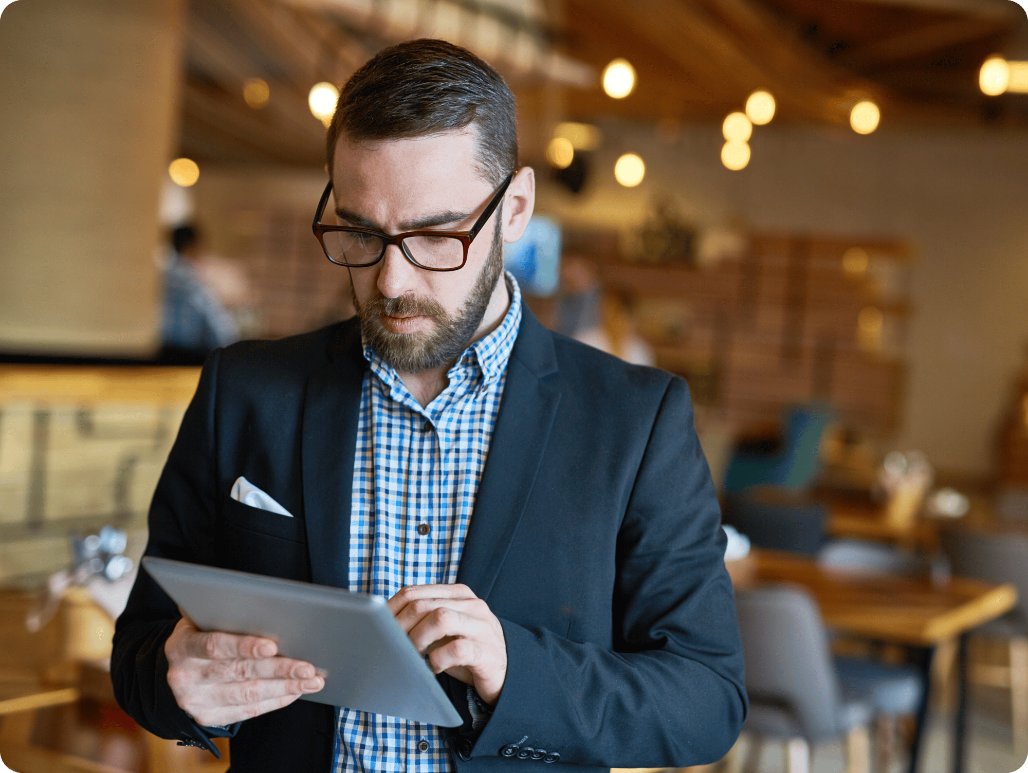 bearded-manager-using-digital-tablet-1 bearded-manager-using-digital-tablet-1